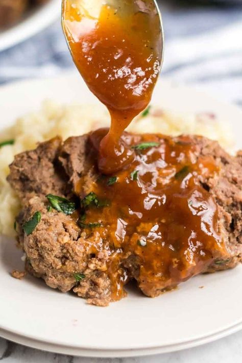 Classic Meatloaf with Brown Gravy for those nights you're feeling nostalgic and want an easy, filling meal. | www.persnicketyplates.com Meatloaf With Brown Gravy, Meatloaf Gravy Recipe, Meatloaf Gravy, Brown Gravy Meatloaf, Best Easy Meatloaf, Meatloaf With Oatmeal, Meatloaf With Gravy, Easy Meatloaf Recipe, Perfect Meatloaf