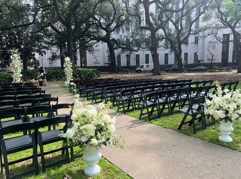 Unveiling the allure of darkness amidst nature's embrace. 🪑 Party Rentals Delivered's Garden Chairs in black create a captivating contrast against the lush greenery, casting a spell of dark romance upon any seating arrangement. Let us bring a touch of enchantment to your special day, where love blossoms against the backdrop of New Orleans' vibrant foliage. Sit, indulge, and immerse yourself in the captivating allure of nature's embrace. 🌿🖤⁠ Black Chair Ceremony, Wedding Ceremony Black Chairs, Black Chair Wedding Ceremony, Black Chairs Wedding Ceremony, Black Ceremony Chairs, Black Chairs Wedding, Wedding Aisle Design, Black Wedding Chairs, Wedding Ceremony Decor Outdoor