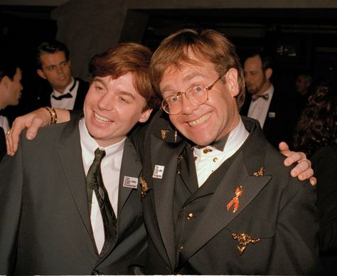 Elton John, right, and comic actor Mike Myers share a laugh at a post-Oscar party hosted by John at the Maple Drive Restaurant in Beverly Hills, March 30, 1993. Mike Myers Actor, Rocketman Movie, Mike Myers, Captain Fantastic, Real Cowboys, Rocket Man, Famous Pictures, Wayne's World, Austin Powers