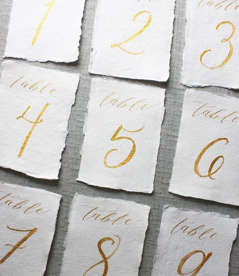 Handmade Paper Place Cards, Hand Lettered Place Cards, Number Calligraphy, Elegant Table Numbers, Calligraphy Table Numbers, Table Number Stands, Wedding Stationery Design, Wedding Table Flowers, Paper Place