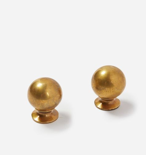 Description Crafted from solid brass with an unlacquered antique finish, the Carlow Brass Knob is an elevated accent for any home. Understated yet elegant, this weighty ball knob can be added to anything from kitchen cabinets to dresser drawers and closet doors for sophisticated refresh. Details Size: 1.125"Dia. x 1.375"D Material: Solid Brass - Unlacquered Antique Finish Mounting Screw(s) Included Care Instructions: Gently wipe with a soft, damp cloth. Do not use chemicals for cleaning. Please Golden Kitchen Hardware, Antiqued Brass Hardware Kitchen, Amber Interiors Lighting, Brass Knobs And Pulls, Cabinet Door Knobs, Vintage Kitchen Hardware, Brass Knobs Dresser, Aged Brass Cabinet Hardware, Brass Trinkets