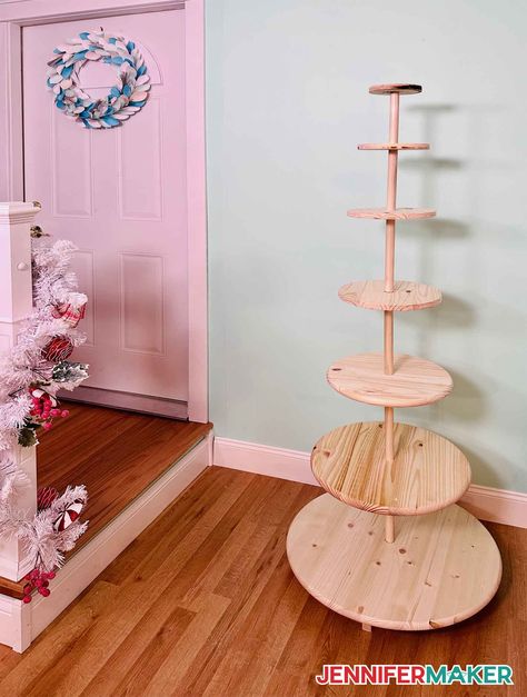 DIY Christmas tree display stand made from wood tabletops and 1" dowels Christmas Tree Village Stand, Christmas Tree Display Stand, Christmas Tree Village Stand Display Ideas, Diy Christmas Tree Shelf, Display Christmas Tree, Christmas Tree Village Display Diy, Christmas Tree Shelf Diy, How To Display Ornaments At A Craft Show, Diy Tabletop Christmas Tree