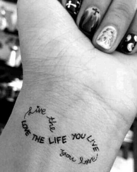 Love and life - a wrist tattoo that will remind you of the important things every single day. #tattoo #quotetattoo #quotes #tattoos Follow us on Pinterest: www.pinterest.com/yourtango Motivation Tattoo, Inner Wrist Tattoos, Tattoos For Women Small Meaningful, Inspiring Quote Tattoos, Good Tattoo Quotes, Small Tattoos With Meaning, Muster Tattoos, Inspiration Tattoos, Infinity Tattoos