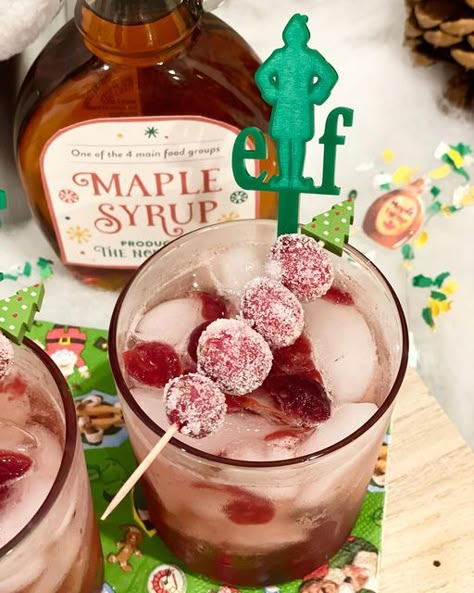 CELEBRATE YOU EVENT DESIGN & PLANNING on Instagram: "I’m doing it. I’m going to toot my own horn here. I’m super proud of this cocktail! I give you the Cranberry Maple Bourbon Elf-tail. Makes 2: 2 T cranberry sauce 2 oz Bourbon 1 oz maple syrup 1/2 oz Grand Marnier Club soda Shake the first 4 ingredients together and pour into cup with ice. Top with club soda! I hate wasting food, so I wanted to find a way to use my cranberry sauce from thanksgiving. I also wanted to play on the Elf movie Elf Movie Themed Cocktails, Buddy The Elf Drink, Buddy The Elf Party Food, Elf Drinking Game, Elf Cocktail, Elf Movie Party, The Elf Movie, Elf Themed Christmas Party, Syrup Labels