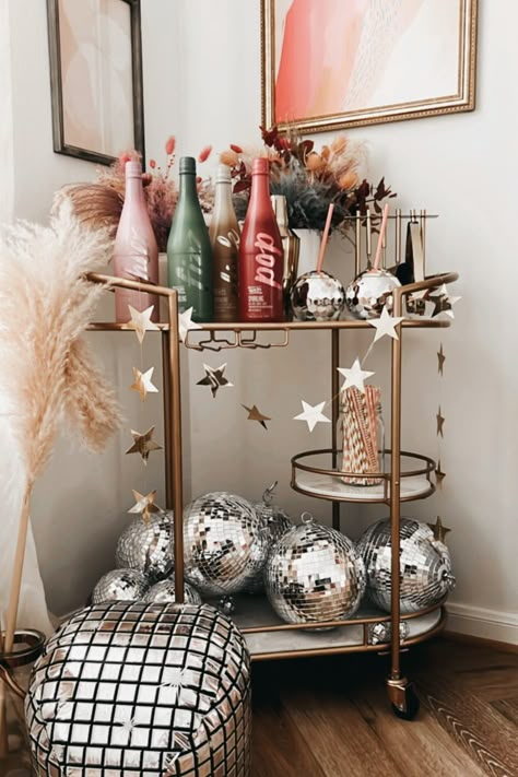 Bar Cart Disco Ball, How To Style A Disco Ball, Bowl Of Disco Balls, Disco Ball Holiday Decor, Disco Kitchen Aesthetic, Disco Ball Bar Cart, Disco Ball Apartment Decor, Disco Ball Arrangement, Disco Cowgirl Apartment