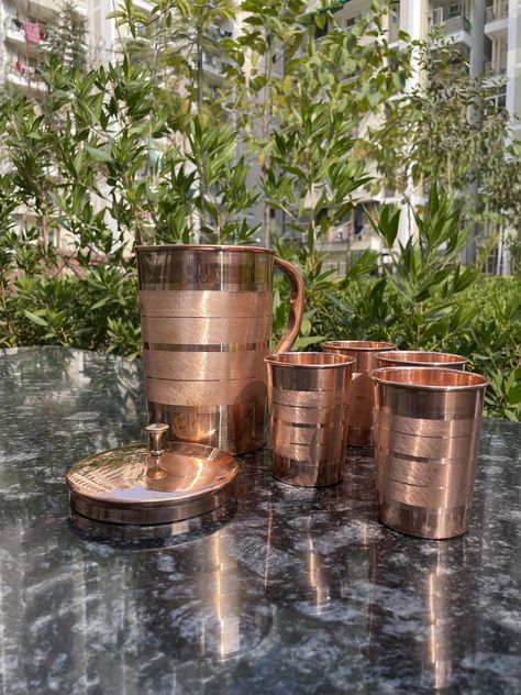 Elevate your hydration game with our Pure Copper Water Jug with Tumblers! Crafted for those who value both style and health, this set is a must-have for any eco-conscious household. Join the movement towards sustainable living today. #CopperWaterJug #HealthyLifestyle #EcoFriendlyLiving #SustainableChoices #DrinkPure #StayHydrated Copper Jug, Copper Design, Ecommerce Store, Eco Friendly Living, Water Jug, House Materials, Hammered Copper, Copper Finish, The Movement