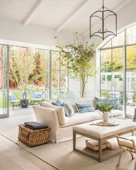 Whimsical living room design with french doors and white panneled ceilings | Giannetti Atherton French Riviera Style, Sala Grande, Casa Country, Timeless Interiors, Coastal Living Rooms, Halong Bay, Pool Design, A Living Room, House And Home Magazine