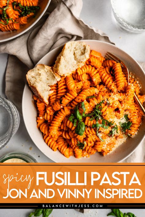 Inspired by Jon and Vinny, this Fusilli alla Vodka is one of the best easy Italian recipes! Creamy, sweet and delicious, your spicy Fusilli pasta with tomato and cream is ready to go in under 30 minutes. Top with basil, parmesan and your favorite protein, and enjoy. John And Vinny Spicy Fusilli, Fusilli Bucati Pasta Recipes, Fusilli Alla Vodka, Fusilli Corti Bucati Recipes, Spicy Fusilli Pasta, Thanksgiving Pasta Recipes, Fusilli Pasta Recipes, Jon And Vinny, Thanksgiving Pasta