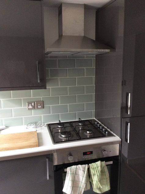 matte grey cabinets and light green subway tile Green Tiled Splashback Kitchen, White Kitchen Green Splashback, Grey Kitchen Green Tiles, Grey Metro Tiles Kitchen, Green Metro Tiles Kitchen, Kitchen Diner Decor, Diy Kitchen Flooring, New Kitchen Inspiration, L Shape Kitchen Layout