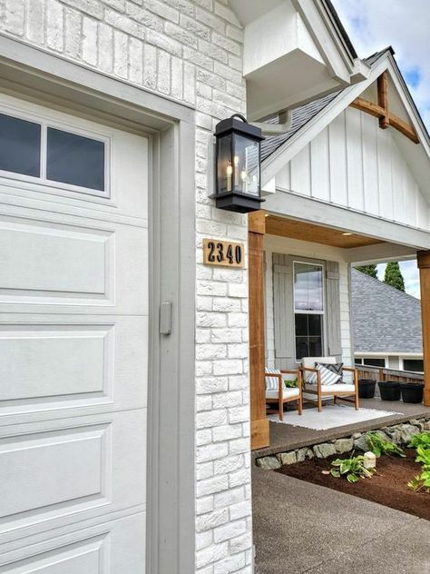 White Brick Porch Ideas, White Brick And Grey Siding Exterior, White Siding White Brick, White Brick Accent Exterior, White Brick Entryway Exterior, White Brick House With Garage, White Brick Wood Accents Exterior, Brick And Siding Painted Houses, White Brick And Hardie Board Exterior