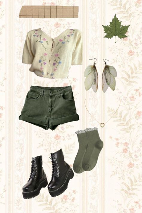 Green fairy core outfit , docs , green shorts, green socks,  flower shirt, wing earrings Flower Academia Outfit, Green Academia Outfit Summer, Summer Fairy Core Outfits, Flower Core Outfits, Green Shorts Outfit Aesthetic, Mushroom Outfit Aesthetic, Art Academia Fashion, Fairycore Shorts, Modern Fairy Aesthetic Clothes