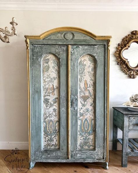 Leah Cook on Instagram: "Antique French pine cabinet, hand painted #folkart insets on Venetian plaster. Layers of gesso and soft blue green milk paint. My interpretation of a folk art marriage armoire. #Marriageblessings. This piece will be available shortly in my @chairishco shop and @encoresociety shop. #paintedbirds #patina #patinastyle #oldworldcharm #beautifulhome #meaningfulart #familyheirloom #uniquefurniture #brocante #brocantestyle" Wallpaper Armoire, Hand Painted Armoire, Armoire Makeover Ideas, Green Armoire, Green Milk Paint, Pine Cabinet, English Cottage Interiors, Swedish Interior Design, Armoire Makeover