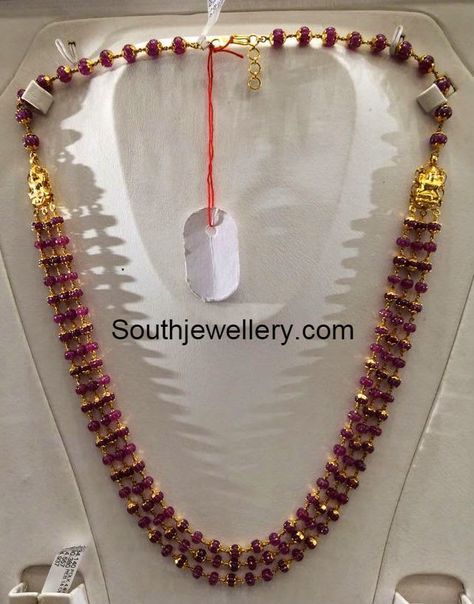 22 carat gold ruby beads necklace with three strings of ruby beads attached to Lakshmi motifs on either side. For price inquiries contact: dharmesh25@yahoo.com Related PostsRuby Beads NecklaceLight Weight Ruby South Sea Pearl NecklaceAntique Necklace With Elephant PendantRuby Beads and South Sea Pearls NecklaceRuby Strings Mala and Lord Ganesh NecklaceKajal Aggarwal Mother in Ruby Strings Latest Jewellery Designs, Ruby Jewelry Necklaces, Necklace Ruby, Black Beads Mangalsutra Design, Pearl Necklace Designs, Gold Necklace Indian Bridal Jewelry, Beaded Necklace Designs, Gold Necklace Simple, Jewellery Indian