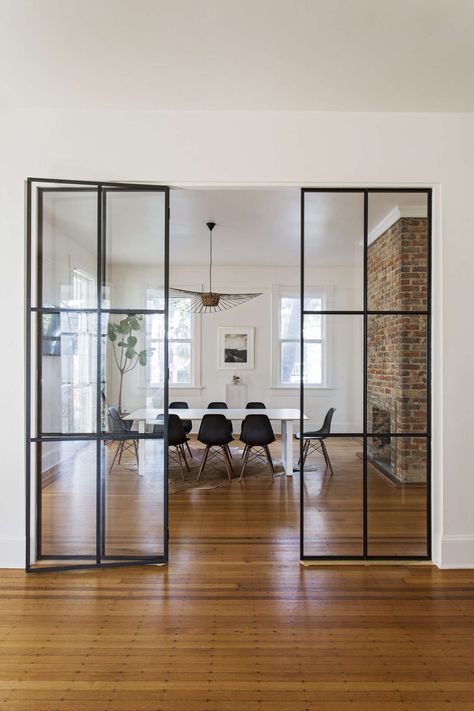 Exotica at Work: Inside a Historic Office in Charleston, Plus 13 Ideas to Steal - Remodelista Exposed Brick Fireplaces, Fireplace Glass Doors, Nyc Townhouse, Glass Partition Wall, Welcome Signs Front Door, Fireplace Doors, Popular Instagram, Glass Partition, House Office