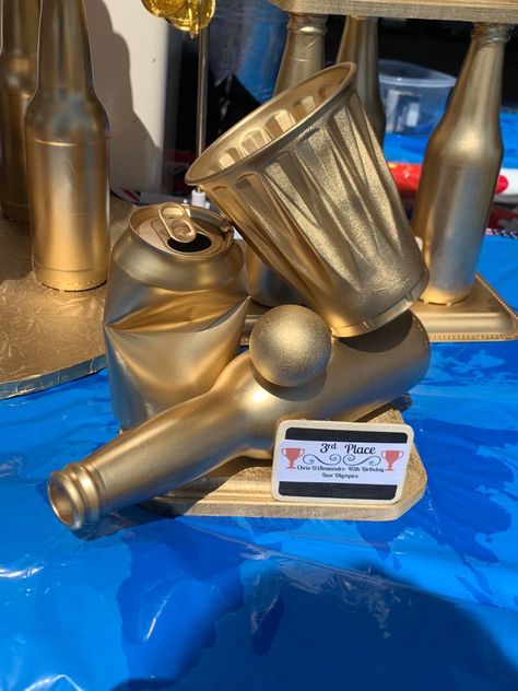 Beer Pong Tournament Outfits, Beer Trophy Diy, Beer Pong Trophy Diy, Beer Olympic Trophies, Fun Olympic Games For Adults, Bar Olympics Games, Beer Olympics Trophy Diy, Winter Beer Olympics Games, Birthday Beer Olympics