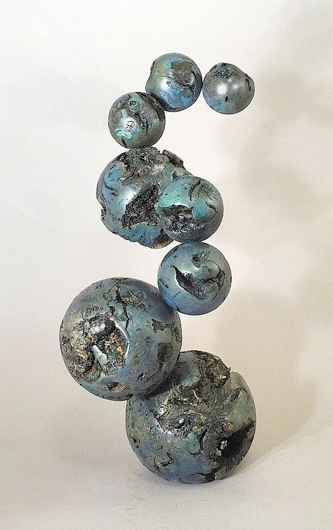 These spheres are turned from grape vines planted in about the 1930’s or 40’s on our farm. I turned these spheres from grapevine trunks, two of them with large root balls. I dyed them and finished it with water-based poly. I assembled the spheres into an unlikely arrangement to make a sculpture of high visual “tension”. The piece stands 23  inches high, and rotates on an embedded lazy susan. I can hear Dionysus, god of grape and wine and drunken revelry, celebrating. Ball Sculpture Art, Ceramic Sphere Sculpture, Pottery Sphere, Sphere Art, Sphere Sculpture, Dionysus God, Ball Sculpture, Grape Vine Plant, Art Studio Room