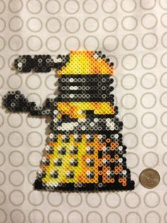 Dalek Magnet from Doctor Who perler beads by Sinister Studios Doctor Who Crafts, Geeky Craft, Nerd Crafts, Melty Bead Patterns, Beads Patterns, Fuse Bead Patterns, Hama Beads Design, Geek Crafts, Perler Crafts