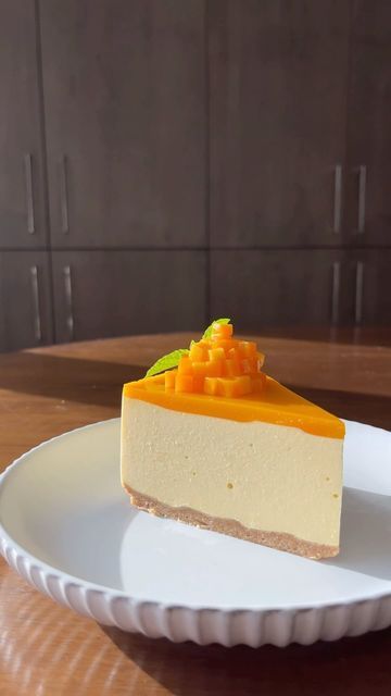 Alex Trim on Instagram: "Throwback Thursday - Mango Yuzu Cheesecake

Mango Yuzu Cheesecake

Crust:
1 1/4 cup crushed graham crackers
1/3 cup melted butter
1Tbsp sugar
1/2 tsp cinnamon
1/2 tsp sesame oil

Cheesecake:
3/4 cup mango purée
3tsp gelatin
1/2 cup cold water
14oz @phillycreamchs cream cheese
1/3 cup sour cream
1tsp vanilla extract
1 1/2 cup heavy cream (whipped to hard peaks)
1/4 cup sugar

Jelly:
1.5 tsp gelatin
1/8 cup water
1/4 cup yuzu juice
1/2 cup mango purée

-To make the crust combine all ingredients in a food processor. Pulse until incorporated but not gummy.
-Line a 9” springform baking pan with parchment. Spray the sides with non-stick spray. 
-Press the crust into the pan evenly. Let chill in the fridge while you continue prep.
-Add the cheesecake gelatin to the water, Cheesecake Crust, Mango Puree, Dessert Dishes, Jamaican Recipes, Heavy Cream, Baking Pans, Graham Crackers, Melted Butter, Vanilla Extract