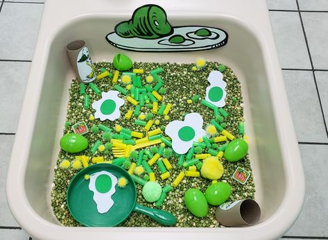 Green Eggs & Ham Sensory Bin! The Lorax Sensory Bin, Green Eggs And Ham Sensory Bin, Cat In The Hat Sensory Bin, Dr Seuss Sensory Bin Preschool, Dr Seuss Sensory Bin For Toddlers, Dr Suess Sensory Bin Ideas, Dr Seuss Toddler Activities, March Sensory Bin Ideas, Green Eggs And Ham Activities Preschool