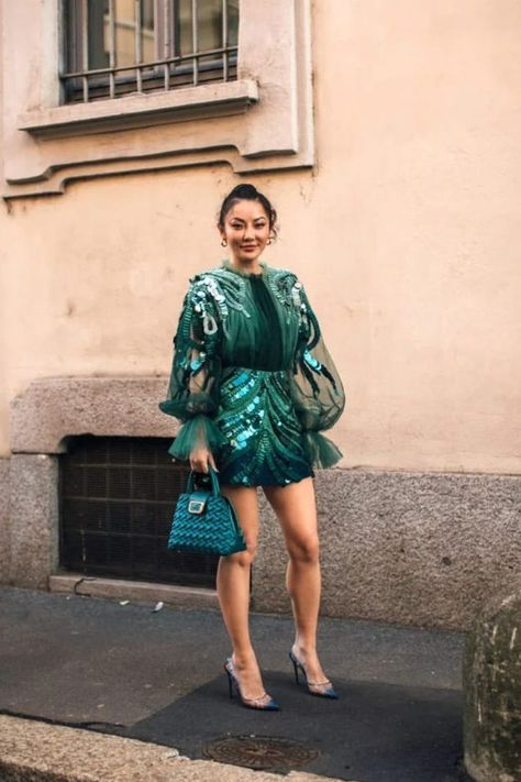 Discover the best shoe colors to style with an emerald green cocktail dress, perfect for classy evening looks! This blog post dives into the best styling ideas, from classic neutrals to bold hues, ensuring your outfit is both stylish and classy. We just love this short sequin dress on Jessica Wang with blue heels and accessories! | �©Launchmetrics Green Sequin Cocktail Dress, Green Sequin Dress Outfit, Emerald Green Cocktail Dress, Short Sequin Dress, Sequin Dress Outfit, Jessica Wang, Cocktail Dress Outfit, Green Sequin Dress, Short Green Dress