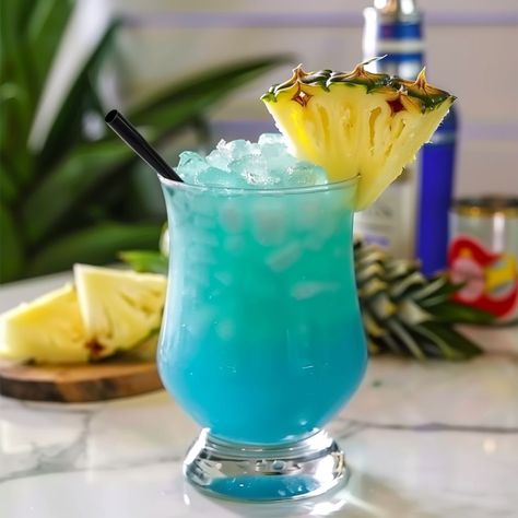 Sharing is caring!The Electric Shark Cocktail is a vibrant, tropical drink that combines spiced rum, blue curacao, and pineapple juice, topped off with ginger beer. Its bright blue color is visually striking, reminiscent of ocean waters, making it an eye-catching choice for any summer gathering or beach-themed party. This cocktail balances the sweet and fruity … Blue Hawaiian Drink, Hawaiian Drinks, Beach Themed Party, Summer Gathering, Tropical Drink, Blue Curacao, Spiced Rum, Blue Hawaiian, Shark Week