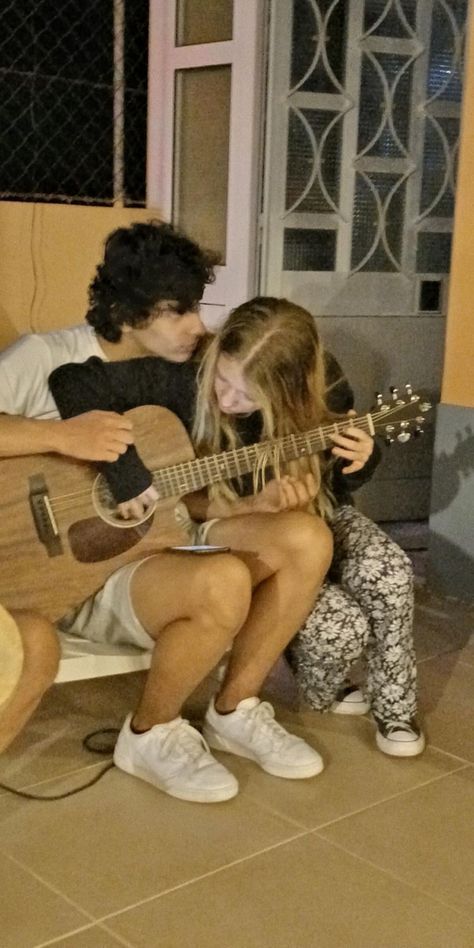 Teaching Guitar Couple, Boyfriend Singing To Girlfriend, Couple Goal Fun, Two People Playing Guitar, Couple Guitar Aesthetic, Guitarist Boyfriend Aesthetic, Guy Playing Guitar Aesthetic, Boy Playing Guitar Aesthetic, Guitar Couple Aesthetic