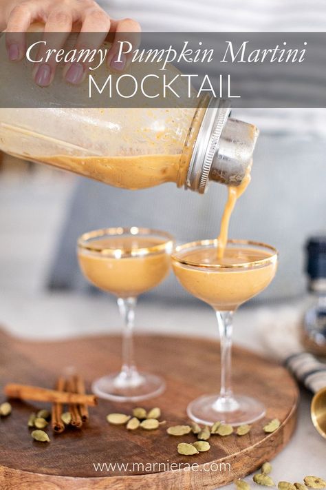 This Creamy Pumpkin Martini Mocktail will be your go-to drink for fall parties. With the perfect combination of pumpkin, cream, and spices, it's like a slice of pumpkin pie in a glass. | Marnie Rae || #drinkrecipes #pumpkinspice #falldrinks Pumpkin Martini, Easy Mocktail Recipes, Martini Ingredients, Fall Parties, Leftover Pumpkin, Martini Shaker, Non Alcoholic Cocktails, Martini Recipes, Milk Shake