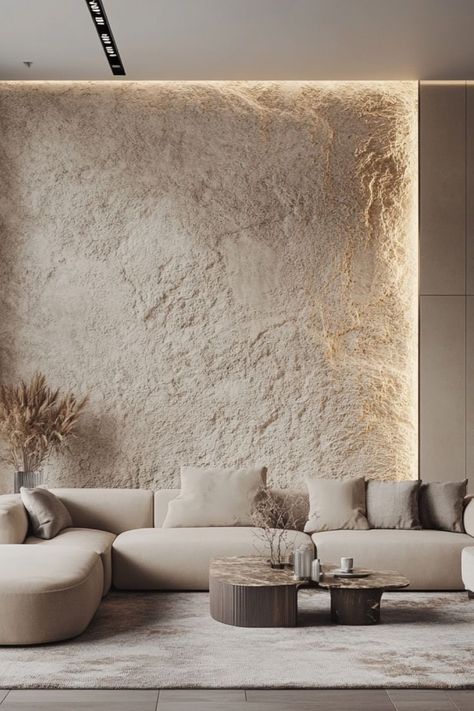 Add dimension with textured accent walls to elevate your modern space. #AccentWalls #TexturedInteriors #ModernDecor Concrete Style Wall, Textured Cement Wall, Living Room Main Wall Design, Heavy Textured Walls, Concrete Texture Wall Interiors, Clay Wall Texture, Rustic Textured Walls, Stone Feature Wall Living Room, Lime Stone Wall