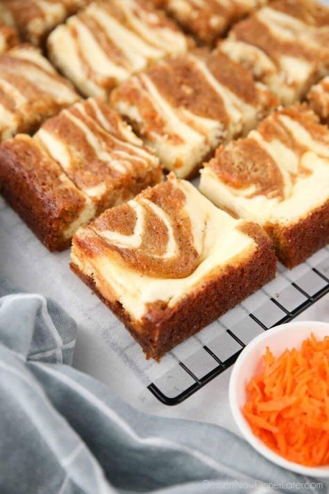 Carrot Cake Cheesecake Bars combine a simple spiced carrot cake with a creamy vanilla cheesecake. The two batters are swirled together to make the most delicious and beautiful marbled carrot cake blondies. Blondie Cheesecake Bars, Mini Carrot Cake Cheesecake, Carrot Cheesecake Recipe, Carrot Cream Cheese Bars, Carrot Cheesecake Bars, Box Carrot Cake Cheesecake Easy, Easy Carrot Cake Bars, Carrot Cake Cheesecake Brownies, Carrotcake Cheesecake Bars