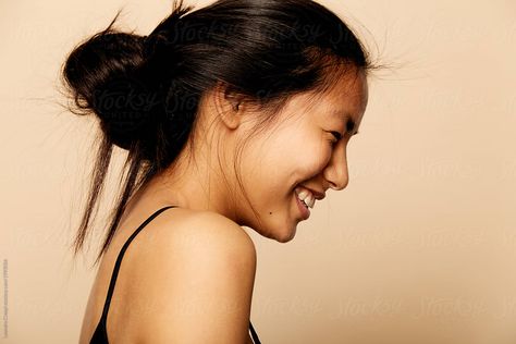 Young beautiful Asian woman portrait smiling isolated over colorful background by Leandro Crespi for Stocksy United Smiling Woman Photography, Woman Smiling Side Profile, Happy Side Profile Drawing, Side View Smile Reference, Person Smiling Side Profile, Side Profile Smile Reference, Smiling Side Profile Drawing Reference, Side Smile Drawing, Side Profile Looking Down