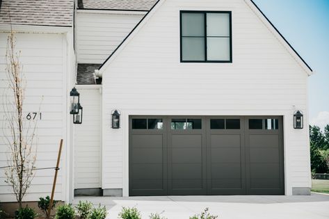 Custom Cornerbrook Garage Doors | Vidor Garage Doors Black Garage Doors, Black Garage, White Siding, Two Tone Paint, Traditional Homes, Black Board, Black Windows, Carriage House, Stain Colors