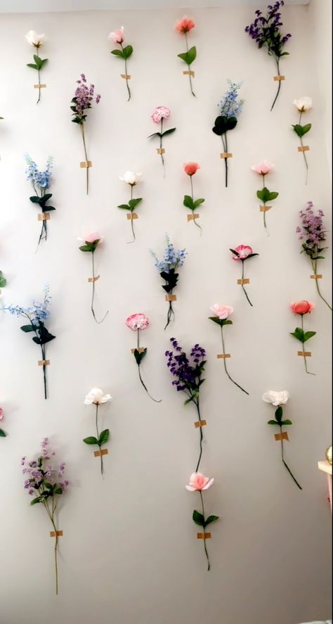 All tbw flowers came from the dollar store, and I used paper taoe from there as well. 10/10 would recommend something stronger though. Flower Aesthetic Decoration, Tape Flowers To Wall, Roses On Wall Decor, Hanging Flower Bedroom, Flower Decor Aesthetic, Flowers On The Wall Decoration, Flower Stem Wall, Cute Flower Decor, Flowers Taped To Wall