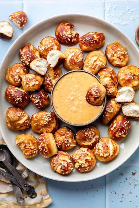 This soft pretzel recipe is perfect for game day, served with homemade beer cheese that’ll have your tastebuds singing! Make this savory snack to serve or anytime the craving strikes. Pretzels And Queso, Pretzel And Beer Cheese Recipe, Beer Cheese And Pretzels, Beer Cheese Dip For Pretzels Easy, Soft Pretzel Charcuterie Board, Pretzels And Beer Cheese Recipe, Pretzel Board Ideas, Pretzel Bites And Beer Cheese, Homemade Beer Cheese