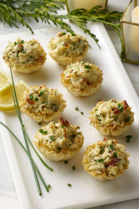 Cheesy Crab Stuffed Phyllo Cups recipe. Decadent and creamy crab filling in crispy phyllo cups. The perfect, bite-size party food for your next gathering. Philo Cups, Tastefully Simple Recipes, Gourmet Appetizers, Phyllo Cups, Creamy Crab, Crab Stuffed, Roasted Onions, Crab Dip, Tastefully Simple