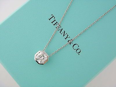 Elsa Peretti® letter pendant. Sterling silver, small. Letters A-Z available. | Tiffany & Co. Diamond Pendant Necklace Solitaire, Diamond Solitaire Pendant, Ruby Rings, Haikou, Solitaire Pendant Necklace, Tiffany Jewelry, Valentino Rockstud, Blue Box, Tiffany And Co