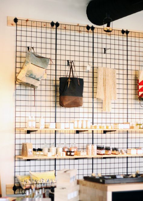 Daytrippin’ | City + State Coffee Shop Coffee Shop Retail Design, Kallax Retail Display, Grid Wall Retail Display, Coffee Shop Merch Display, Coffee Shop And Clothing Store, Coffee Shop Storage, Cafe Shelf, Coffee Shop Display, Wall Decor Coffee Shop