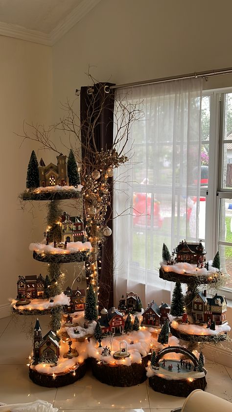 Christmas Village On Cake Stand, Stand For Christmas Village, Christmas Tree With Village Underneath, Christmas Village Stands Display Ideas, Rustic Christmas Village Display, Crate Christmas Village, Under Christmas Tree Ideas, Christmas Tree Village Display Ideas, Christmas Village Set Up