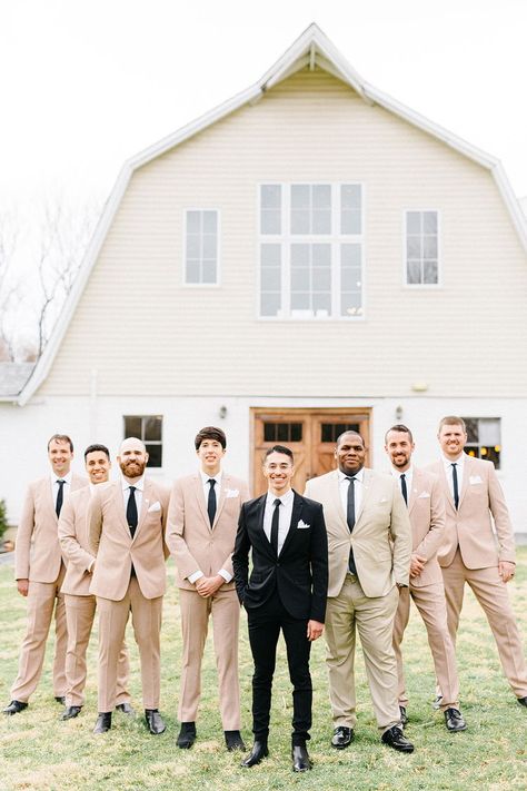 The groom wore classic black tux and groomsmen wore tan suits for a black and tan rustic wedding  #weddingphotos #virginiawedding #barnwedding #weddingparty #groomsmen #tanwedding #beigewedding #weddingportraits #rusticwedding #weddingideas #weddinginspiration #farmwedding #weddingvenue #48fields Black Groom Tan Groomsmen, Groom In Beige Groomsmen In Black, Tan Groomsmen Suits Black Groom, Tan Suit Groom Black Suit Groomsmen, Tan Suit With Black Tie, Khaki And Black Groomsmen Attire, Black Tux Groom Tan Suit Groomsmen, Black And Beige Wedding Party, Tan And Black Suit Wedding