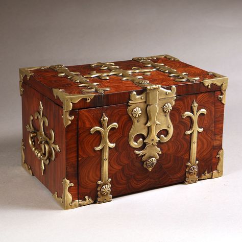 A 17th century Kingwood strongbox with gilt brass straps. This strongbox has to be one of the most charming and certainly the smallest example we have encountered, at just 17.5 cm high, 28 cm wide and 18 cm deep.