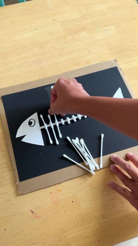 This activity got my 3yo so interested in counting! She was having so much fun inserting the cotton buds to make her skeleton fish. This is great find... | By Happy Tot Shelf - Raising Happy Learners Skeleton For Kids, Fish Crafts Preschool, Skeleton Craft, Skeleton Fish, School Art Activities, Fish Activities, Fish Skeleton, Kindergarten Art Projects, Art Activities For Toddlers