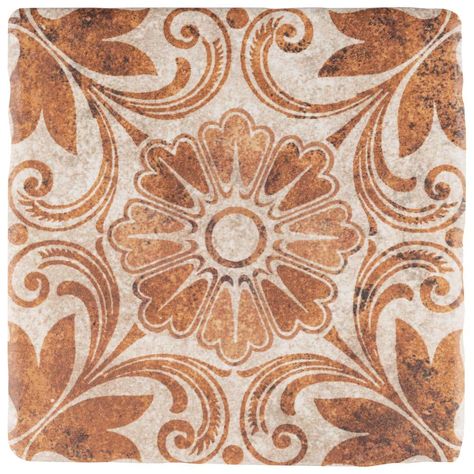 Our Merola Tile Costa Arena Decor Dahlia Encaustic 7-3/4 in. x 7-3/4 in. Ceramic Floor and Wall Tile has a classic, rustic look to it that complements many different decors. With a textured feel and rough stone look, this tile offers floral decor patterns in tawny, ochre and terracotta tones that replicate a distressed, aged look. Composed of ceramic, this tile has a deep, rich tone to it and a matte surface that can be used in residential floor and wall installations including, backsplashes, po Wall Tile Texture, Tile Texture, Floor Trim, Merola Tile, Spanish Tile, Casa Exterior, House Tiles, Tiles Texture, Ceramic Floor