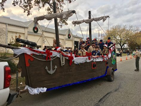 Christmas pirate ship parade float Pool Parade Float Ideas, Pirates Of The Caribbean Parade Float, Pirate Homecoming Float, Pirate Parade Float Ideas, Boat Float Parade Ideas, Pirate Ship Float Parade, Pirate Floats For Parade, Peter Pan Float Parade, Christmas Pirate