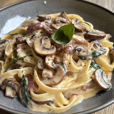 Tagliatelle Carbonara with Mushrooms 🍝🍄 Ingredients: - 300g tagliatelle - 150g mushrooms (sliced) - 2 eggs - 100g grated parmesan - 2 cloves garlic (minced) - 150ml crème fra�îche - Olive oil - Salt and pepper (to taste) - Fresh parsley (to garnish) Instructions: 1. Start by bringing a large pan of salted water to the boil. Once boiling, add the tagliatelle and cook according to the packet instructions until al dente. Remember to reserve about a cup of the cooking water before draining the p... Tagliatelle Carbonara, Creamy Mushroom Pasta, Mushroom Pasta, Creamy Mushrooms, Jambalaya, Sliced Mushrooms, Creamy Sauce, Couscous, Minced Garlic