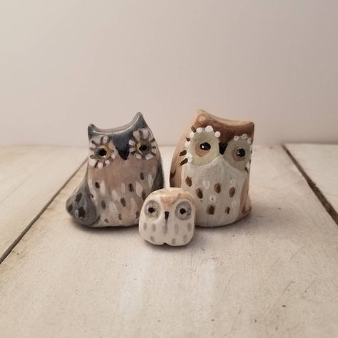 This sweet family of owls is eager to warm your heart and home.  Each figure is hand-sculpted out of polymer clay, hand-detailed with acrylic paint and sealed with a gloss varnish. These are one-of-a-kind, original sculptures.  About the Owl Spirit Animal: The owl spirit strengthens our connection to wisdom and intuition. It helps us find deeper meaning beyond what is visible. The owl spirit guides us to the truth and allows us to see through illusion and deceit.  *This piece is delicate and bre Clay Owls, Owl Pottery, Polymer Clay Owl, Owl Figurines, Clay Owl, Clay Bird, Diy Air Dry Clay, Sculpey Clay, Deeper Meaning