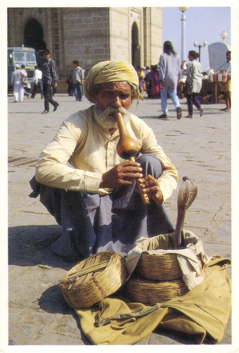 Snake charming is the practice of pretending to hypnotise a snake by playing an instrument called pungi. The practice is most common in India. One of the earliest records of snake charming appears in the Bible in Psalm (58:3–5): "The wicked turn aside from birth; liars go astray as soon as they are born. Their venom is like that of a snake, like a deaf serpent that does not hear, that does not respond to the magicians, or to a skilled snake-charmer."  Mumbai, India. Snake Charmer Aesthetic, Street Photography People, Snake Charmer, Backpacking India, Persian Culture, Halloween 2020, Vintage Artwork, Divine Feminine, Amazing Nature