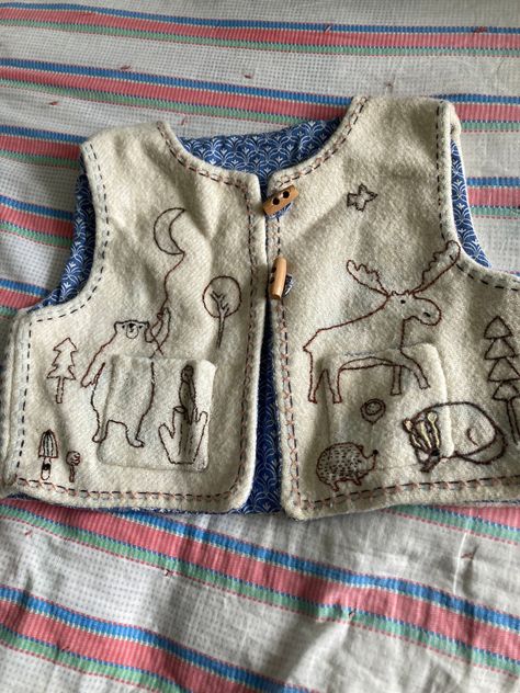 handmade and embroidered childs waistcoat approx age 4/5 . fully lined in vintage cotton fabric . the wool is a recycled vintage blanket . embroidered with whimsical animals . measures pit to pit  15 inches ,length 12 inches . toggle fastenings a useful extra layer . boxy shape . Whimsical Animals, Wool Waistcoat, Embroidered Blanket, Embroidered Vest, Recycled Clothing, Sewing School, Vintage Blanket, Embroidered Wool, Altering Clothes