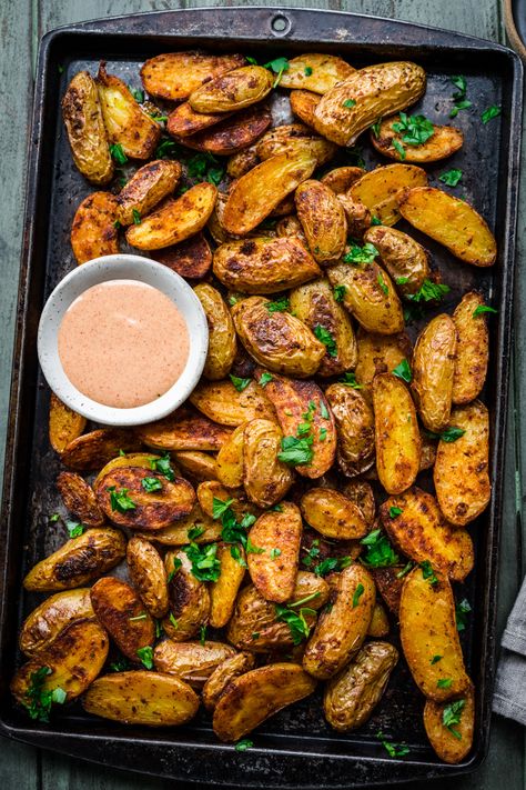 These roasted cajun potatoes are crispy, spicy and absolutely packed with flavor! They're easy to make in less than an hour and are perfect served with a spicy paprika lime dipping sauce. Lime Dipping Sauce, Cajun Potatoes, Air Fry Potatoes, Roasted Fingerling Potatoes, Paprika Potatoes, Roasted Potato Recipes, Potato Wedges, Crispy Potatoes, Fried Potatoes