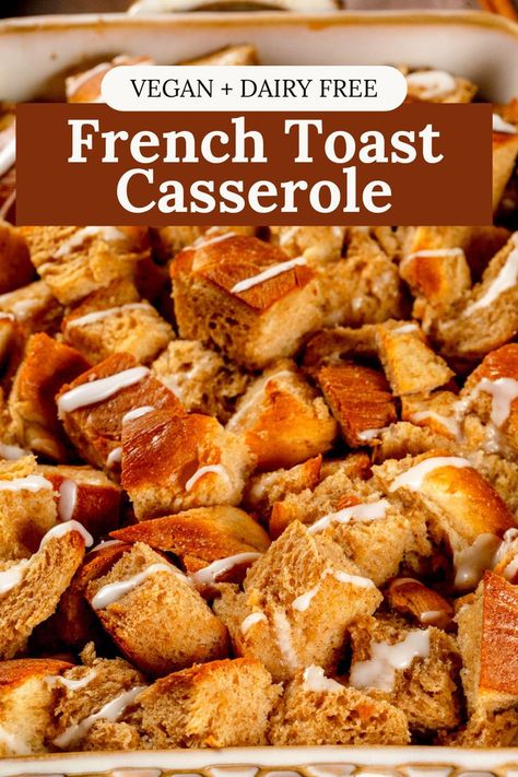 Extreme close up of a baking dish filled with vegan french toast casserole. White icing is drizzled over top of it. Text on the image reads, "vegan and dairy free french toast casserole".