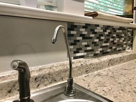 How to use peel and stick tiles to create a gorgeous faux glass tile kitchen backsplash with only scissors and a tape measure!I have been wanting to put a backsplash up behind my kitchen sink for years.However I definitely couldn’t do a real glass tile backsplash by myself and I was pretty sure I couldn’t afford anything that would look decent.When I discovered affordable kitchen tile stickers I found hope. Maybe I could actually DIY my backsplash!In this post I’ll walk you through how… Peel And Stick Glass Tile, Smart Tiles Backsplash, Sink Backsplash, Paint Cabinet, Peel And Stick Tile Backsplash, Glass Tiles Kitchen, Glass Tile Backsplash Kitchen, Brick Backsplash Kitchen, Kitchen Decor Collections