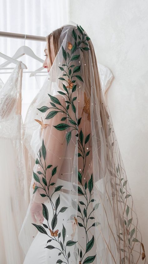 Rue De Seine Wedding Dresses | AN ICON 🕊 The details of our Mountain Song veil are unmatched. Embroidered leaves creep up the sides with intricately stitched birds… | Instagram Rue De Seine Mountain Song Veil, Embroidered Vines Wedding Dress, Wedding Dresses With Leaves, Veil With Leaves, Flower Embroidered Wedding Veil, Bird Wedding Dress, Mexican Wedding Veil, Colorful Veil Wedding, Mexican Veil